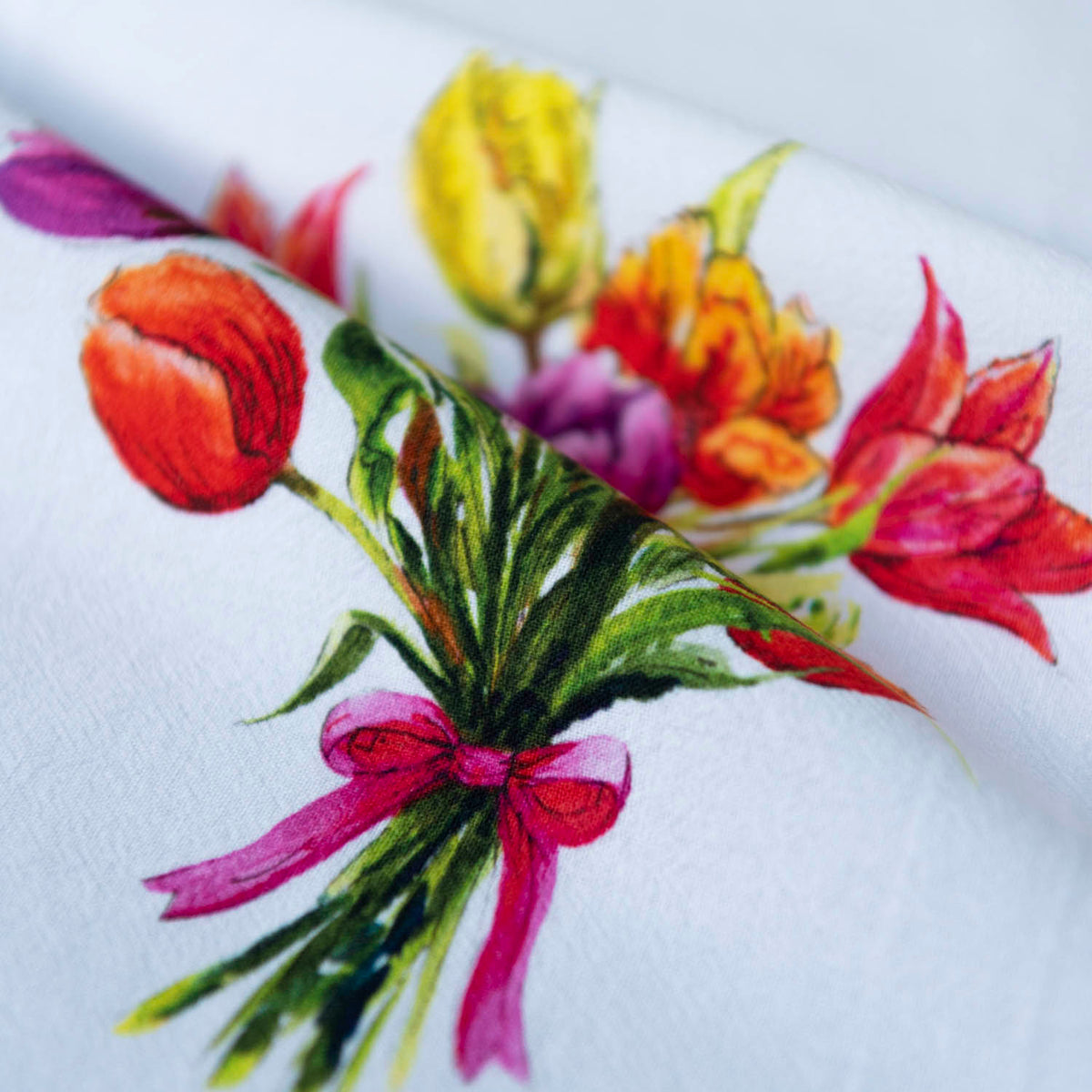 Decorative Kitchen Towel Watercolor Tulip Design White Cotton Fabric Spring Farmhouse Essential Vibrant Floral Bouquet Red Yellow Purple Orange Pink Blooms Green Foliage Pink Ribbon Accent Hanging Loop Practical Dish Towel Fresh Seasonal